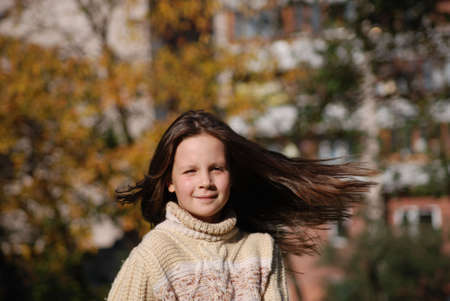 girl with blown  about from wind hairsの写真素材