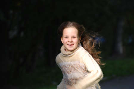 girl with blown  about from wind hairsの写真素材