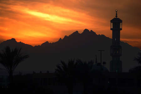 beautiful sunset above mountains and mosqueの写真素材