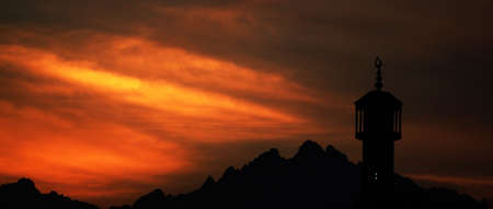 beautiful sunset above mountains and mosqueの写真素材
