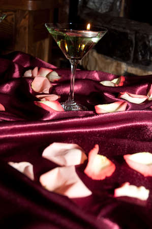 glass with floating candlesの写真素材