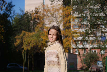 girl with blown  about from wind hairsの写真素材