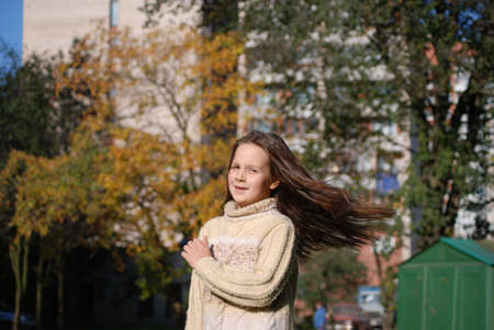 girl with blown  about from wind hairsの写真素材