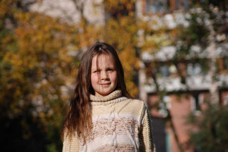 girl with blown  about from wind hairsの写真素材