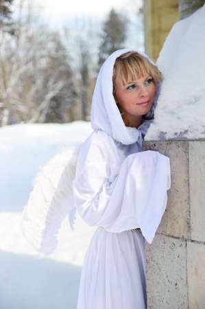 The girl in a white attire with wings of an angelの写真素材