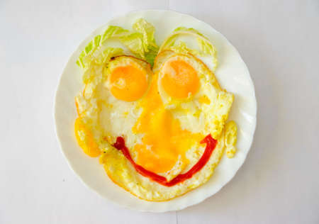 Fried eggs as a faceの写真素材