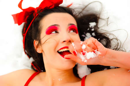 The girl in a red bathing suit on snowの写真素材