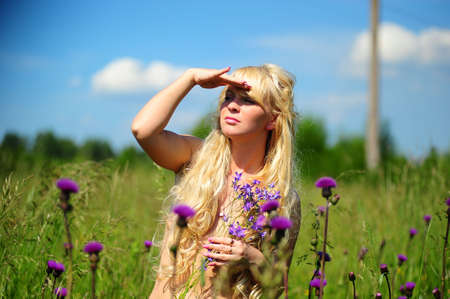 The blonde among a high grassの写真素材