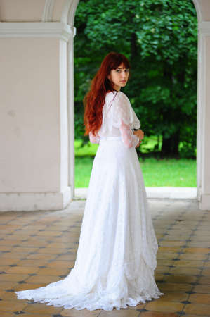 Portrait of a beautiful young victorian lady in white dress Portrait of a beautiful young victorian lady in white dress