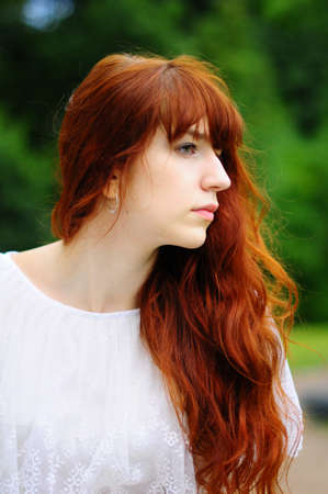 The girl on a balcony at a handrailの写真素材