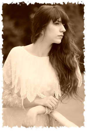 The girl on a balcony at a handrailの写真素材