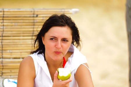 The girl eating an appleの写真素材