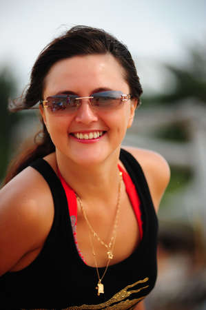 Happy brunette with glasses and pretty smile
