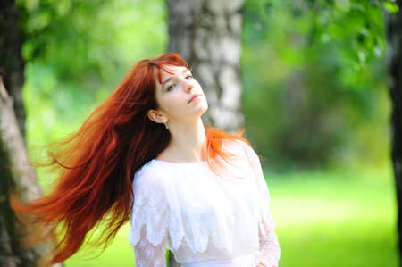 The girl with long red hairの写真素材