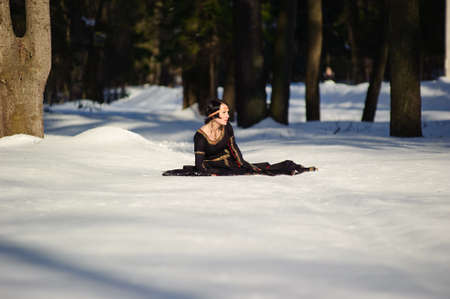 The girl in a medieval dress of the hunterの写真素材