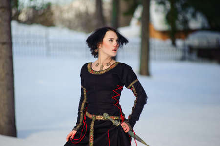 The girl in a medieval dress of the hunter