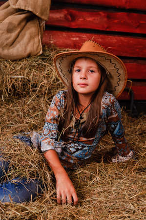 The little girl in a cowboy's hatの写真素材