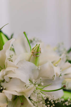 white lilies and wedding ringsの写真素材