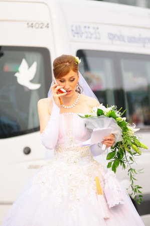 Bride speaking on the phoneの写真素材