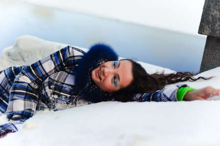 woman lying in the snowの写真素材
