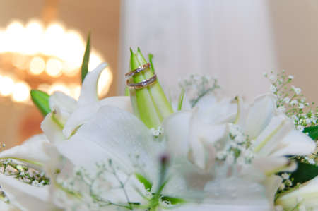 white lilies and wedding ringsの写真素材