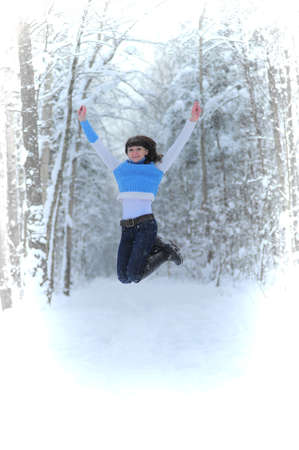 High jumping girl in Winter Parkの写真素材