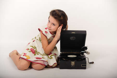 Girl with a gramophone and recordsの写真素材