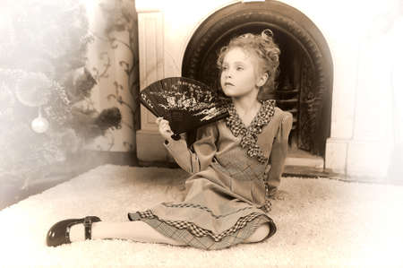 portrait of a little girl with a fanの写真素材
