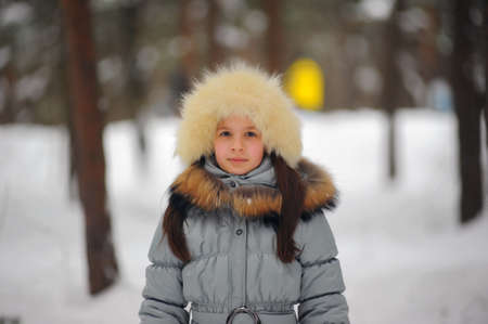 girl in a white fur hatの写真素材