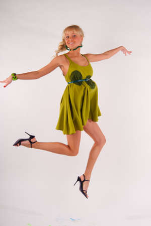 girl jumping high on white backgroundの写真素材