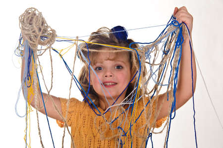 little girls play with balls of woolの写真素材