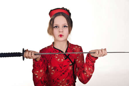 A girl handling a long samurai swordの写真素材
