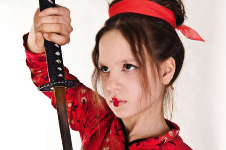 A girl handling a long samurai swordの写真素材