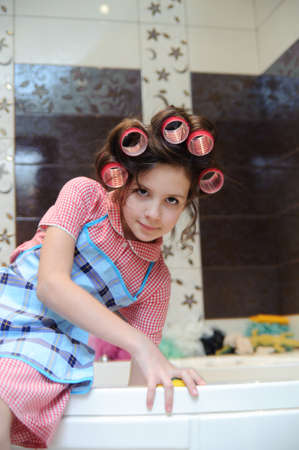 Girl washing the bathroomの写真素材