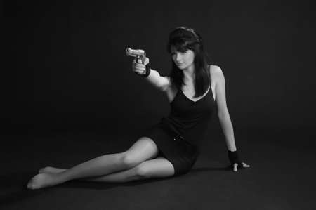 Sexy woman holding gunの写真素材