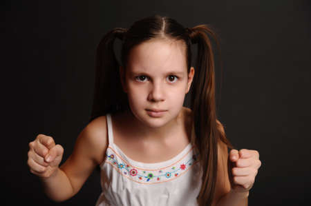 angry girl on a black background