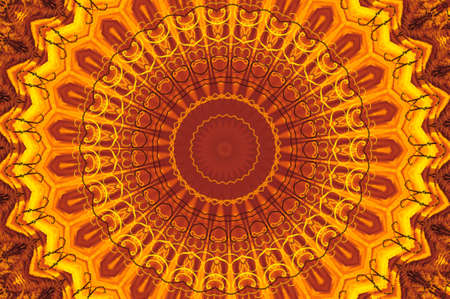 Abstract fractal kaleidoscope in bright warm colors of yellow and orange.の写真素材