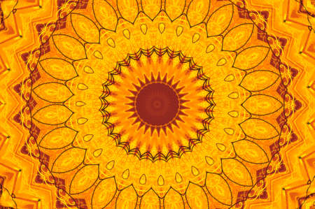 Abstract fractal kaleidoscope in bright warm colors of yellow and orange.の写真素材