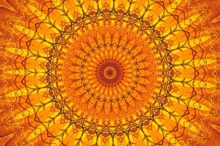 Abstract fractal kaleidoscope in bright warm colors of yellow and orange.の写真素材