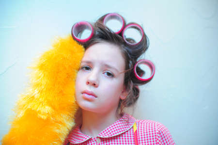 a young housewife with brushes and rollersの写真素材