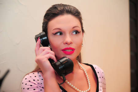 girl speaking on the phone retroの写真素材