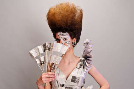 Girl in the newspaperの写真素材