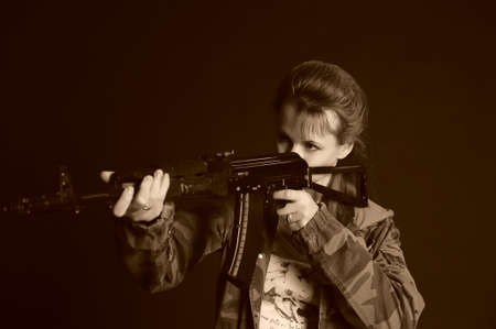 Young military gun womanの写真素材