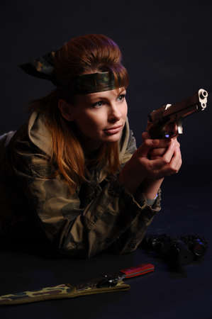 beautiful young woman with a gun