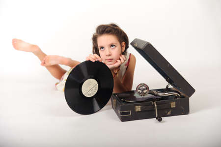 Girl with a gramophone and recordsの写真素材
