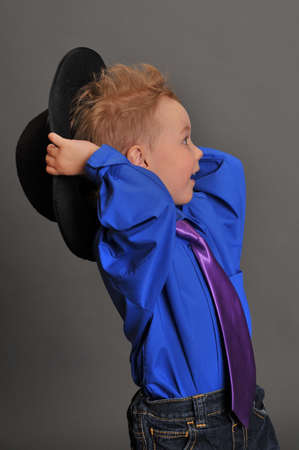 little boy in a hat and tieの写真素材