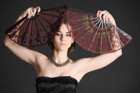 portrait of a girl with two fans