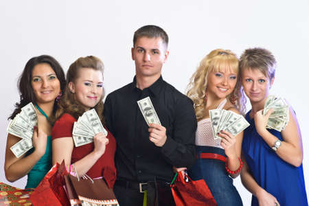 women with shopping bags take money from the manの写真素材