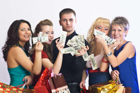 women with shopping bags take money from the manの写真素材