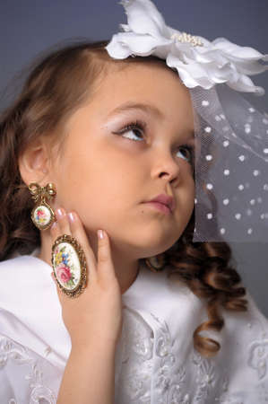 retro portrait of a young girl in a white hat with a veilの写真素材